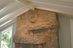 Cape Ann Granite fireplace with ammonite fossil