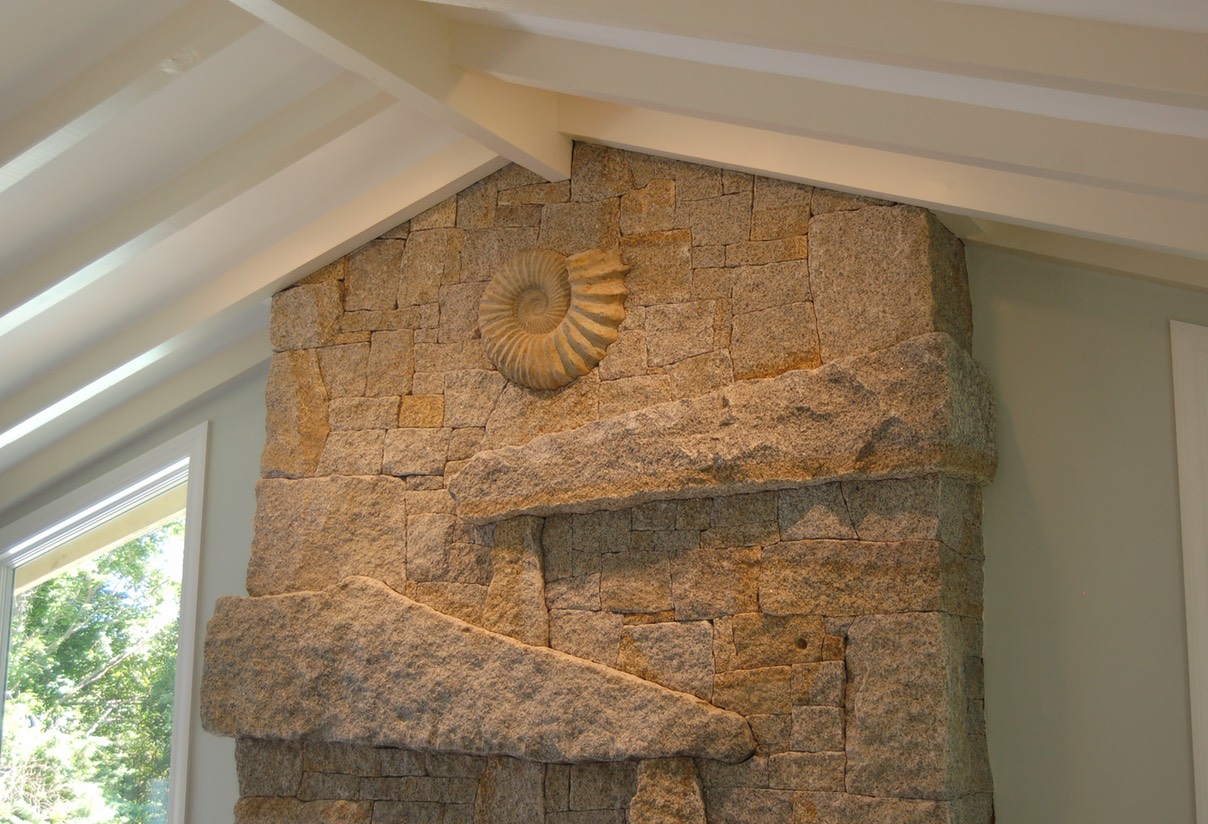 Cape Ann Granite fireplace with ammonite fossil