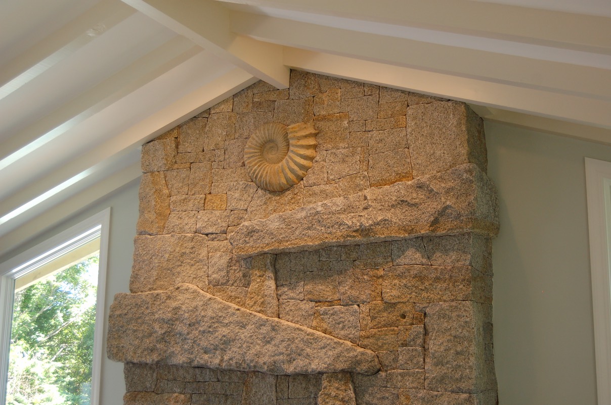 Cape Ann Granite fireplace with ammonite fossil