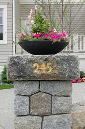 Hand carved number on granite column