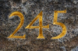 hand carved numbers on granite