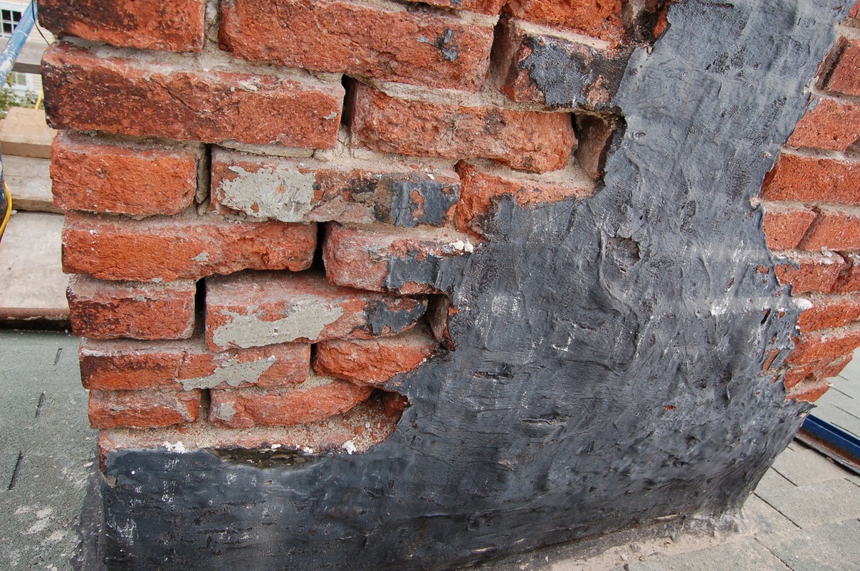 Brick damaged by tar repairs