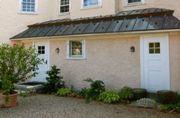 Lime paint application over stucco walls